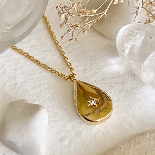 Niobe Teardrop Shaped Charm With Starburst Rhinestone